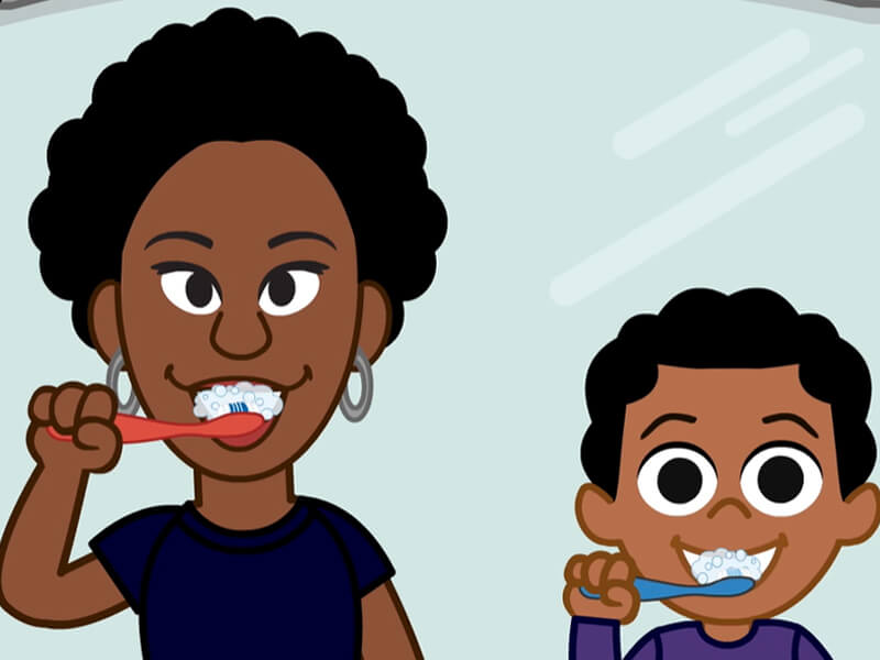 Mama y niña cepillando dientes
